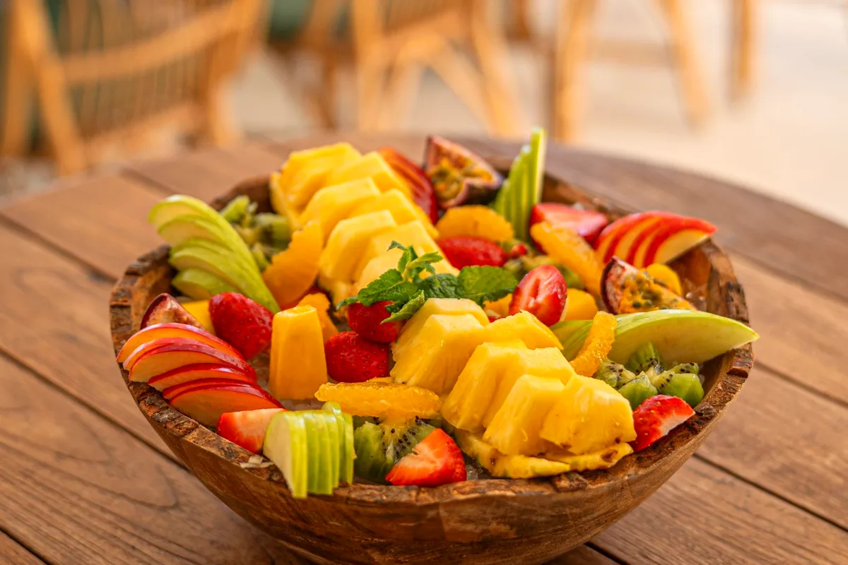 Orange fluff salad with mandarin oranges and pineapple in a serving bowl