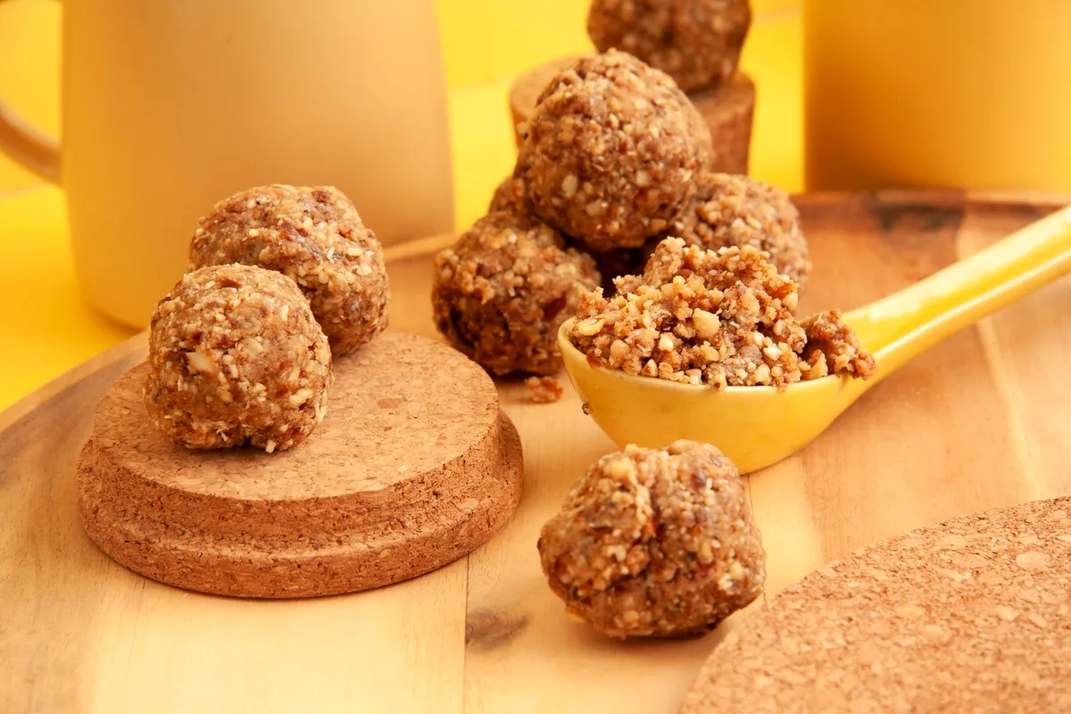 No-bake peanut butter balls coated in chocolate on a serving plate